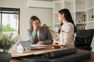 woman consulting with a lawyer about divorce and mortgage in california